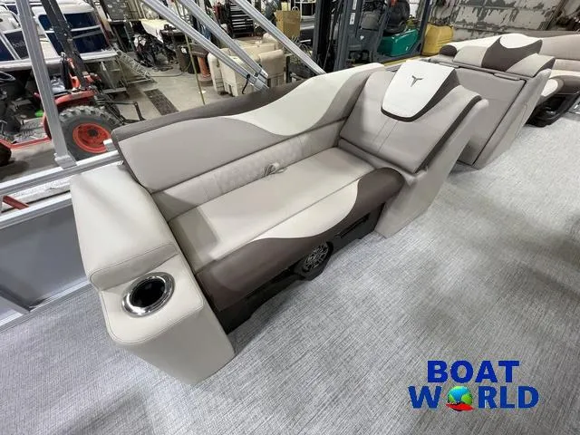 Slide: The Image of 2025 Tahoe LTZ 2385 Elite Cruise Tritoon interior seating with cup holder, showcased at Boat World. - 15