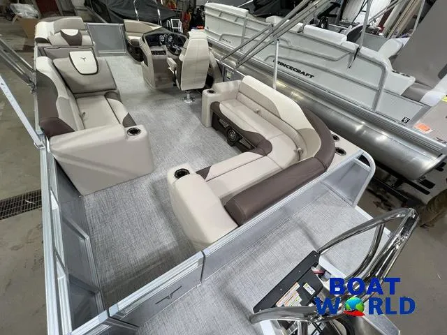 Slide: The Image of 2025 Tahoe LTZ 2385 Elite Cruise Tritoon interior with luxurious seating and modern design. - 23