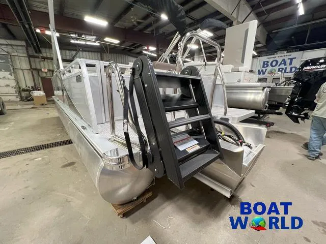 Slide: The Image of 2025 Tahoe LTZ 2385 Elite Cruise Tritoon with Honda 4-Stroke EFI in showroom. - 26