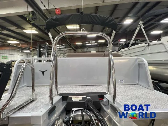 Slide: The Image of 2025 Tahoe LTZ 2385 Elite Cruise Tritoon with Honda 4-Stroke EFI in showroom. - 27