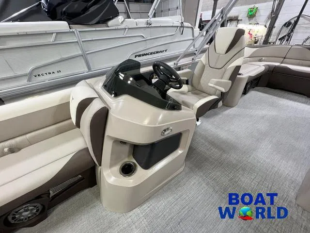 Slide: The Image of 2025 Tahoe LTZ 2385 Elite Cruise Tritoon interior with steering console and seating. - 9