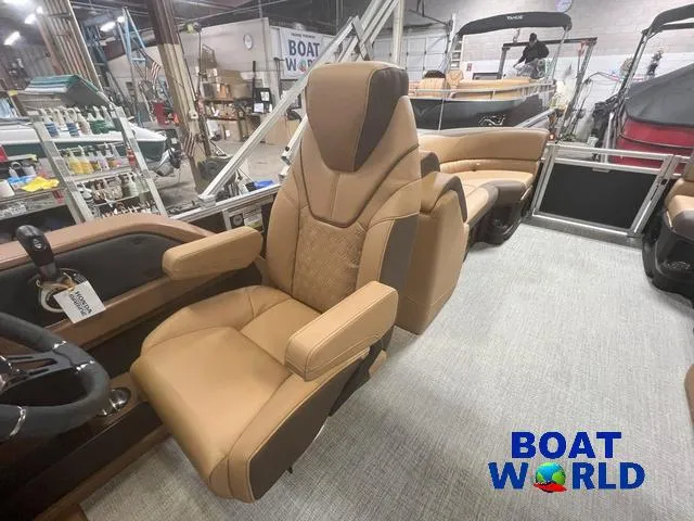 Slide: The Image of 2025 Tahoe LTZ 2385 Quad Lounge interior with luxurious seating at Boat World showroom. - 11