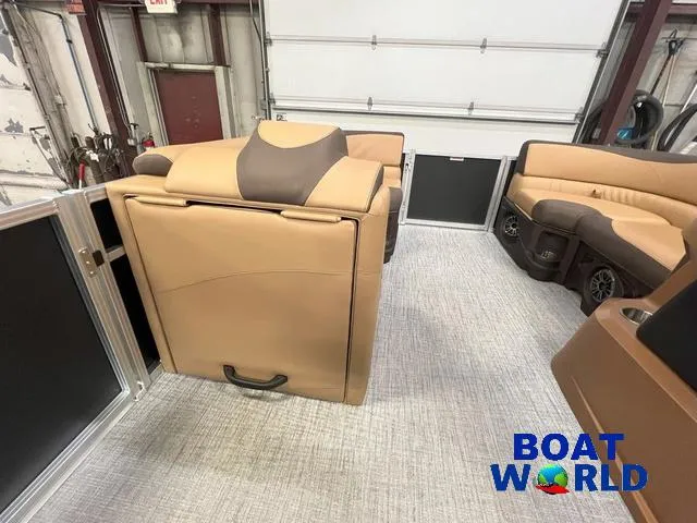 Slide: The Image of 2025 Tahoe LTZ 2385 Quad Lounge interior with tan seating and modern design. - 19