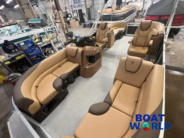 Slide: The Image of Luxurious 2025 Tahoe LTZ 2385 Quad Lounge interior with plush seating in a showroom. - 21