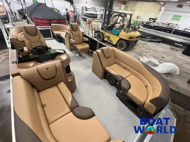 Slide: The Image of 2025 Tahoe LTZ 2385 Quad Lounge interior with luxurious seating at Boat World showroom. - 22