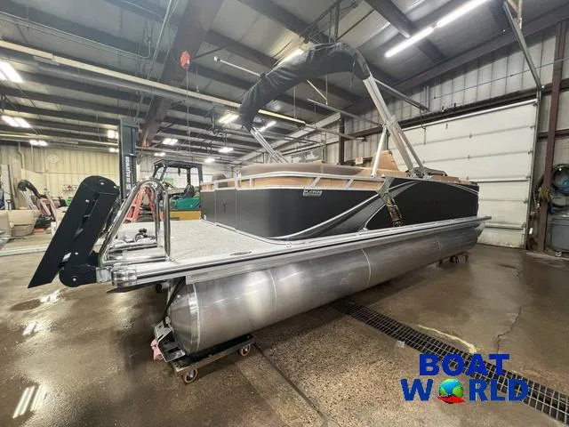 Slide: The Image of 2025 Tahoe LTZ 2385 Quad Lounge pontoon boat in a warehouse setting. - 27