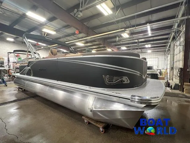 Slide: The Image of 2025 Tahoe LTZ 2385 Quad Lounge pontoon boat in a showroom. - 28