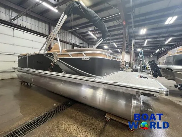 Slide: The Image of 2025 Tahoe LTZ 2385 Quad Lounge pontoon boat in showroom. - 30