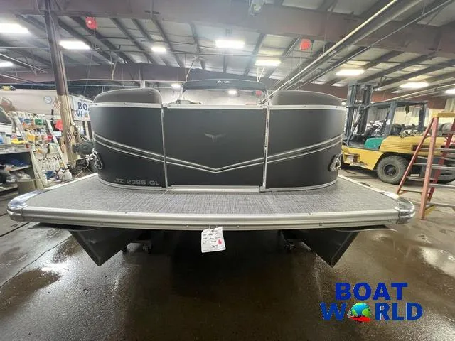 Slide: The Image of 2025 Tahoe LTZ 2385 Quad Lounge boat in showroom, featuring Honda 4-Stroke EFI engine. - 32