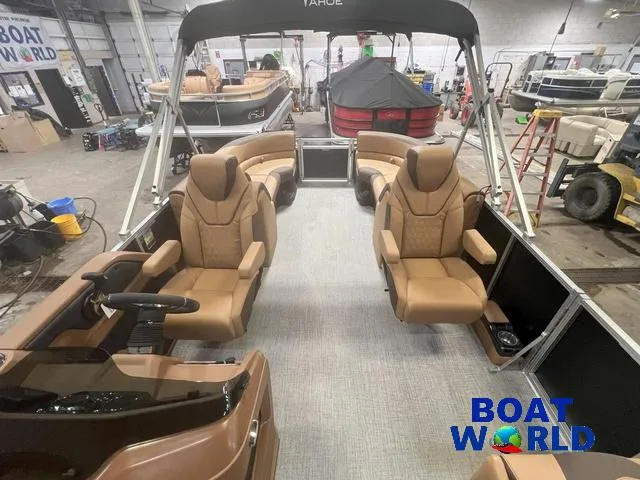 Slide: The Image of 2025 Tahoe LTZ 2385 Quad Lounge boat interior with tan seating in showroom. - 9