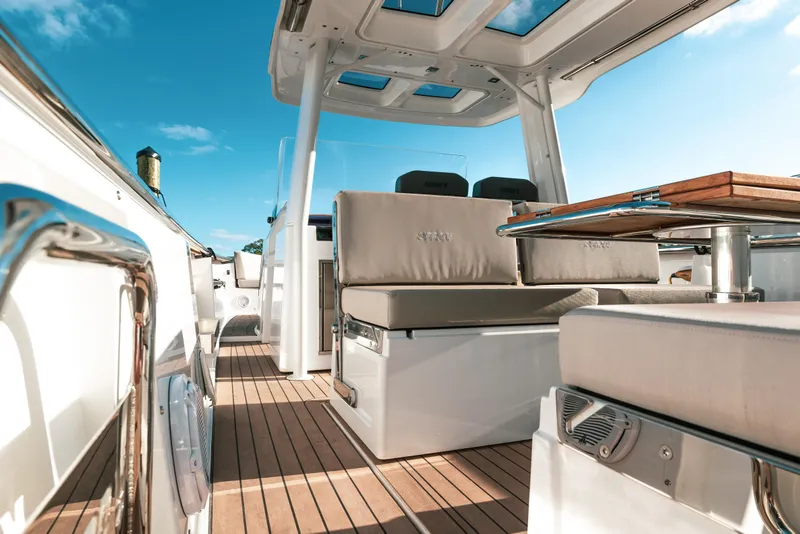 Slide: The Image of 2022 Fjord 38 Open yacht interior with sleek seating and wooden deck. - 20
