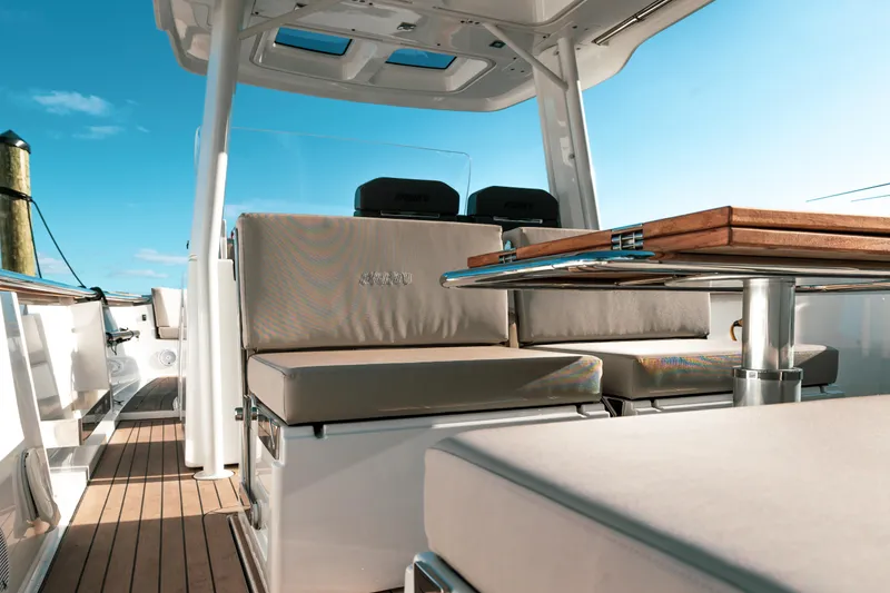 Slide: The Image of Luxurious seating area on 2022 Fjord 38 Open yacht with wooden table. - 21