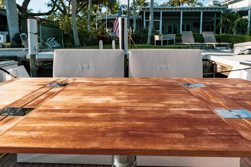 Slide: The Image of Luxury yacht deck with wooden table, Fjord 38 Open, 2022 model. - 26