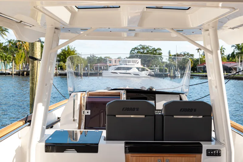Slide: The Image of Fjord 38 Open 2022 boat interior with waterfront view, featuring sleek design and modern amenities. - 30
