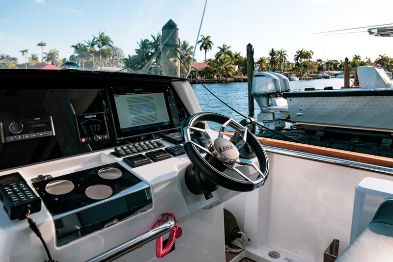 Slide: The Image of Interior view of 2022 Fjord 38 Open yacht cockpit with steering wheel and navigation system. - 44