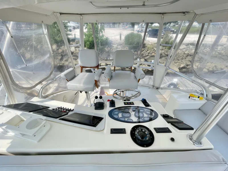 Slide: The Image of Interior helm of 2000 Ocean Yachts 43 Super Sport with dual captain chairs. - 25
