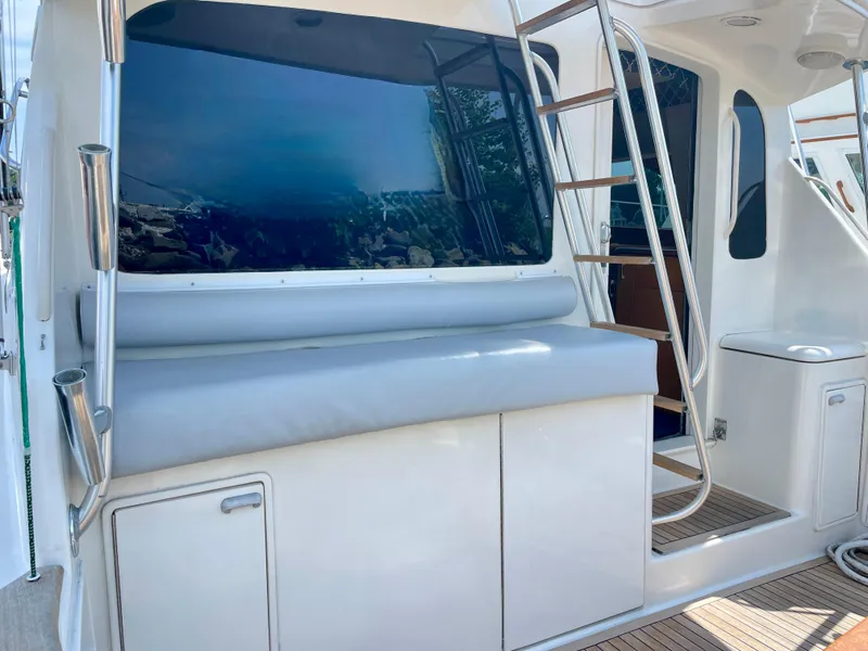 Slide: The Image of Ocean Yachts 43 Super Sport 2000 model, featuring sleek exterior and ladder access. - 28