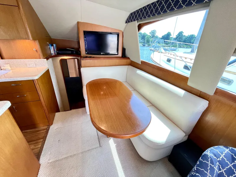 Slide: The Image of Interior of 2000 Ocean Yachts 43 Super Sport with dining area and TV. - 32