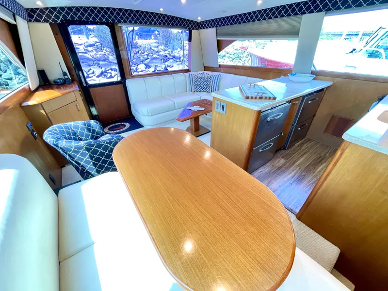 Slide: The Image of Luxurious interior of 2000 Ocean Yachts 43 Super Sport with elegant seating and wood finishes. - 33