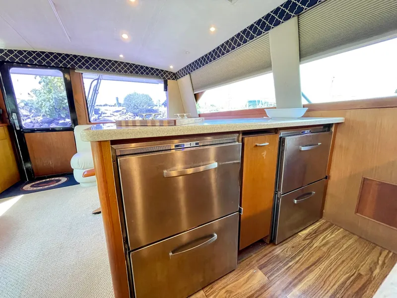 Slide: The Image of Interior of 2000 Ocean Yachts 43 Super Sport with modern kitchen appliances. - 36