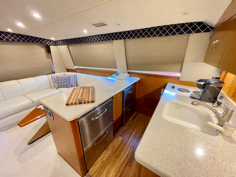 Slide: The Image of Luxurious interior of 2000 Ocean Yachts 43 Super Sport with modern kitchen and seating area. - 40
