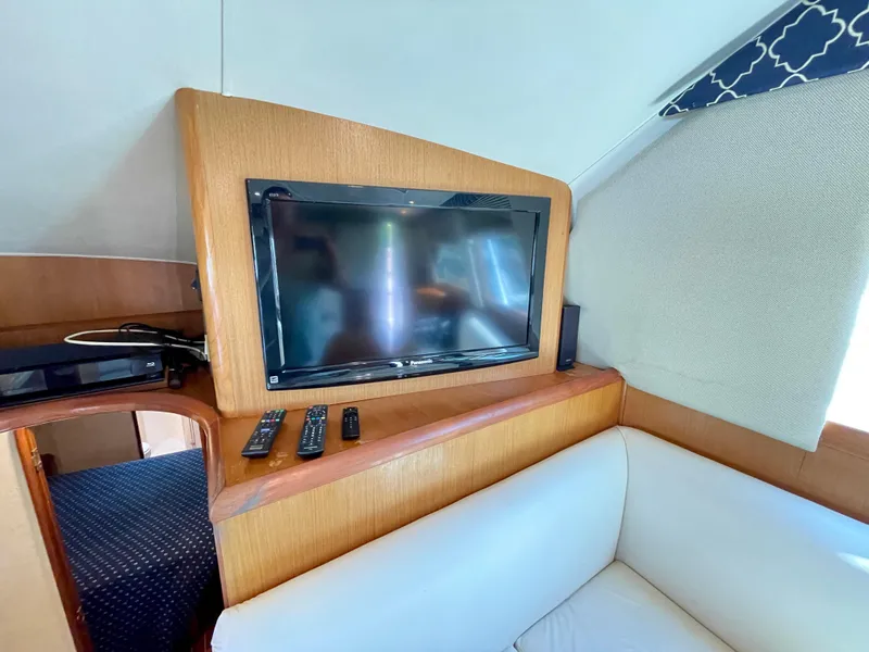 Slide: The Image of Interior of 2000 Ocean Yachts 43 Super Sport with TV and remote controls. - 42