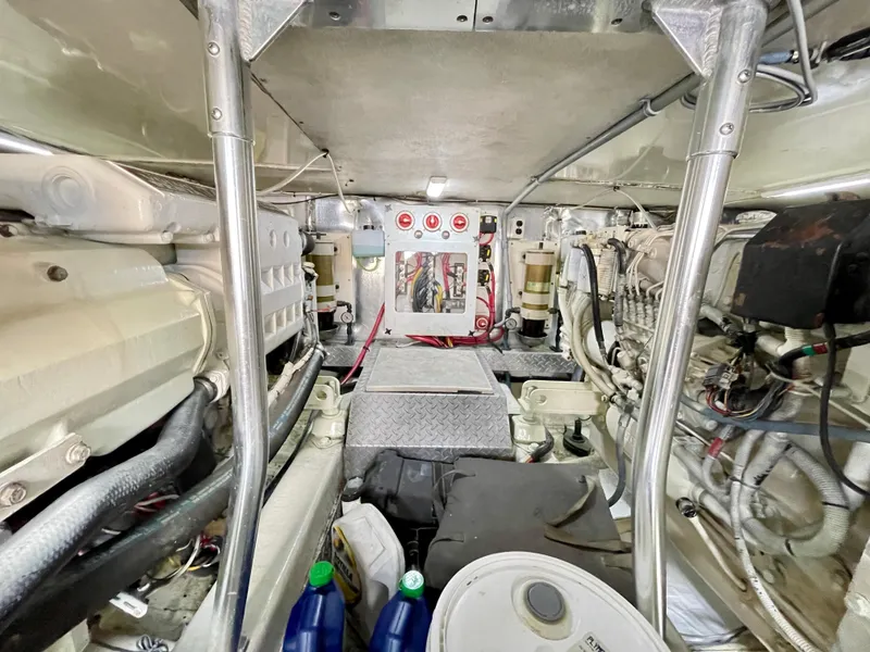 Slide: The Image of Engine room of 2000 Ocean Yachts 43 Super Sport, showcasing mechanical components and wiring. - 43