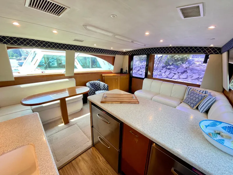 Slide: The Image of Luxurious interior of 2000 Ocean Yachts 43 Super Sport with modern seating and dining area. - 5