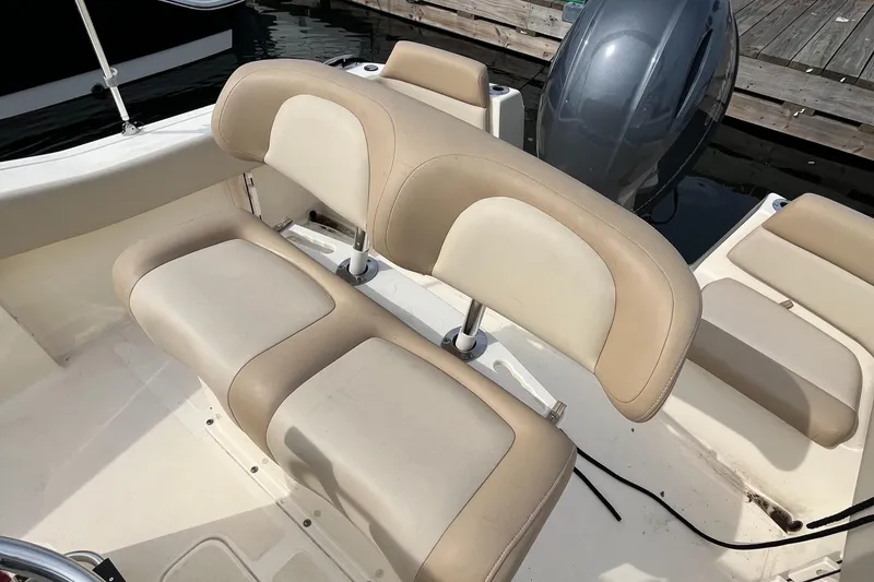 Slide: The Image of 2024 Scout 195 Sportfish boat seating and motor detail. - 12