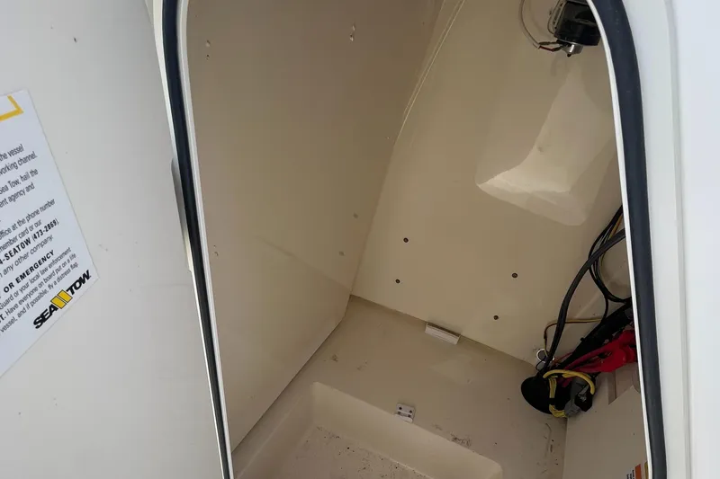 Slide: The Image of 2024 Scout 195 Sportfish storage compartment interior view. - 15