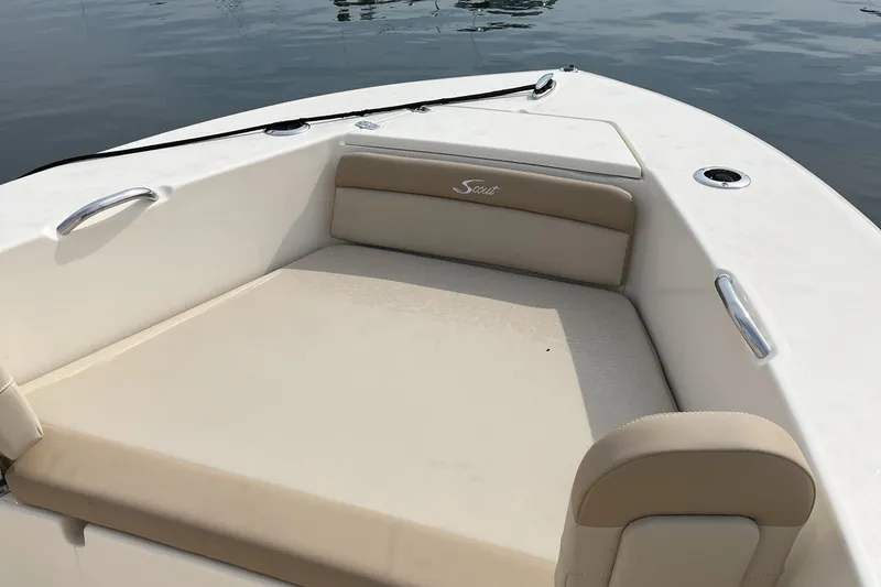 Slide: The Image of 2024 Scout 195 Sportfish boat interior with cushioned seating. - 16