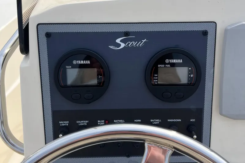 Slide: The Image of 2024 Scout 195 Sportfish dashboard with Yamaha gauges and steering wheel. - 20