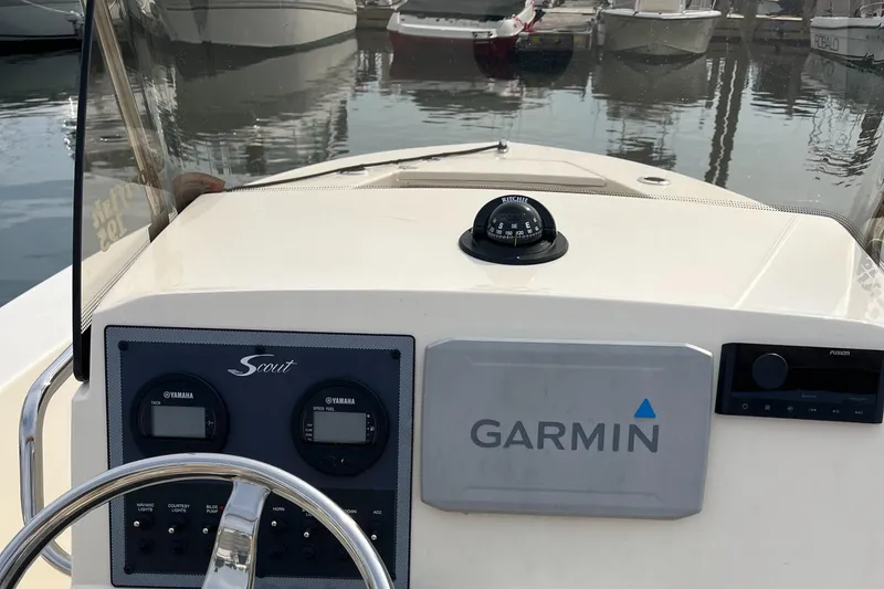Slide: The Image of 2024 Scout 195 Sportfish boat dashboard with Garmin navigation system. - 21