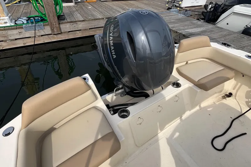 Slide: The Image of 2024 Scout 195 Sportfish boat with Yamaha outboard engine at dock. - 7