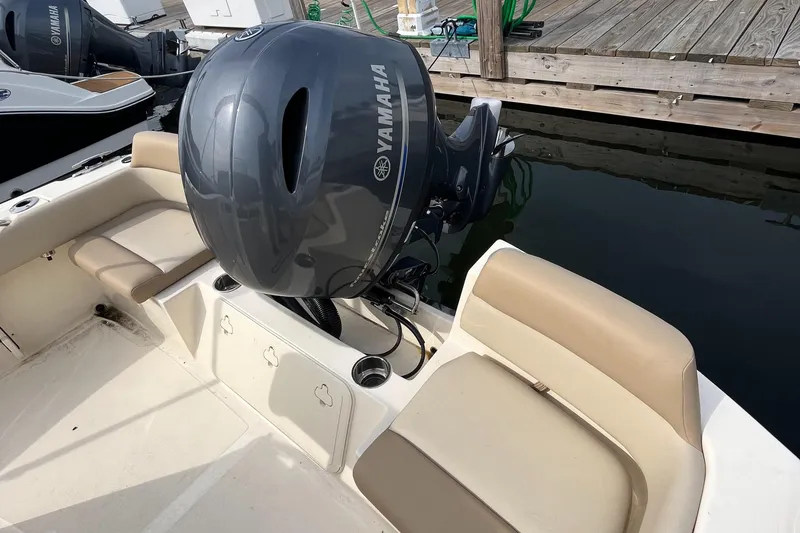 Slide: The Image of 2024 Scout 195 Sportfish boat with Yamaha outboard motor at dock. - 8