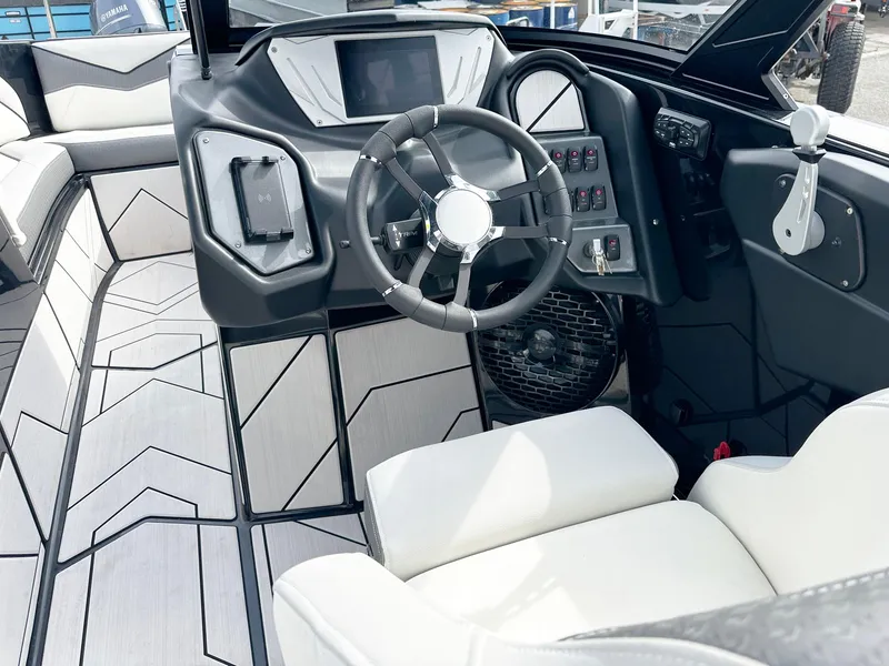Slide: The Image of 2024 Supreme S240 boat interior with modern dashboard and steering wheel. - 10