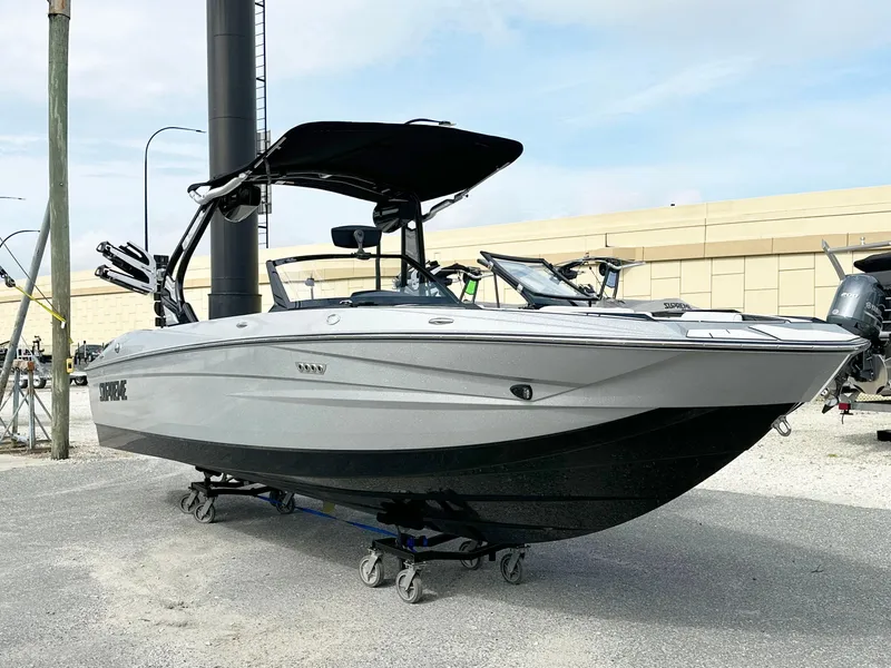 Slide: The Image of 2024 Supreme S240 boat with sleek design on display outdoors. - 3