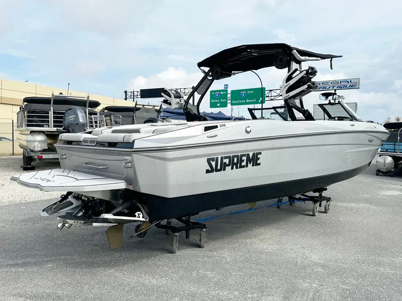 Slide: The Image of 2024 Supreme S240 boat displayed outdoors, featuring sleek design and modern features. - 4