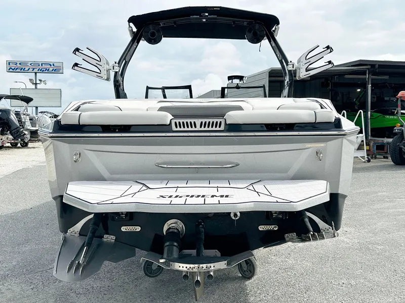 Slide: The Image of 2024 Supreme S240 boat rear view with swim platform and wakeboard tower. - 5