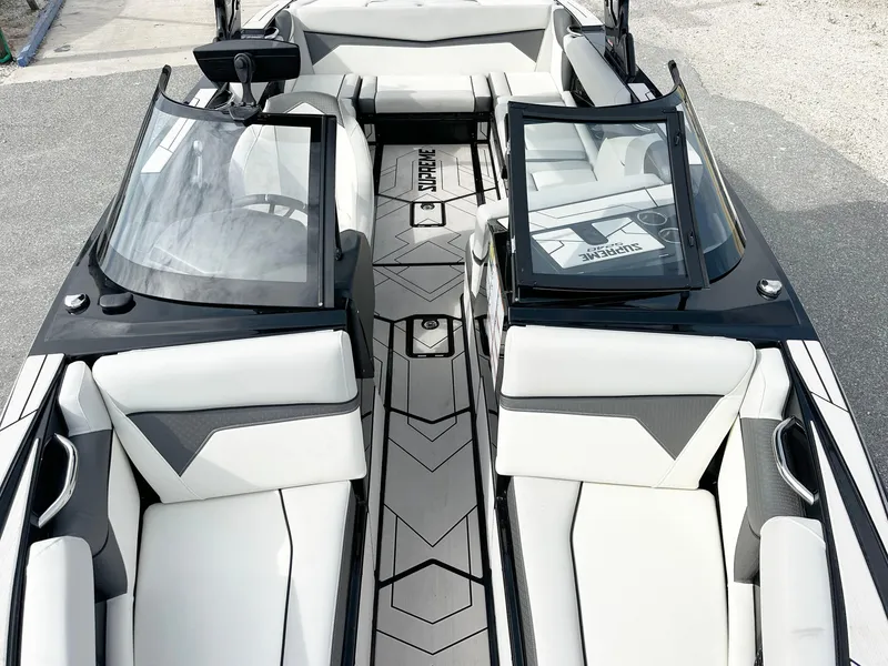 Slide: The Image of 2024 Supreme S240 boat interior with sleek seating and modern design. - 6