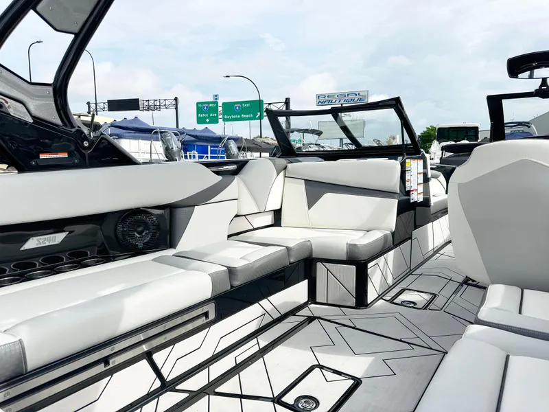 Slide: The Image of 2024 Supreme S240 boat interior with modern seating and sleek design. - 9