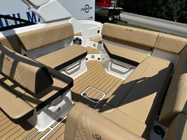 Slide: The Image of Luxurious seating on 2025 Sea Ray SDX 270 boat with tan upholstery and spacious layout. - 4