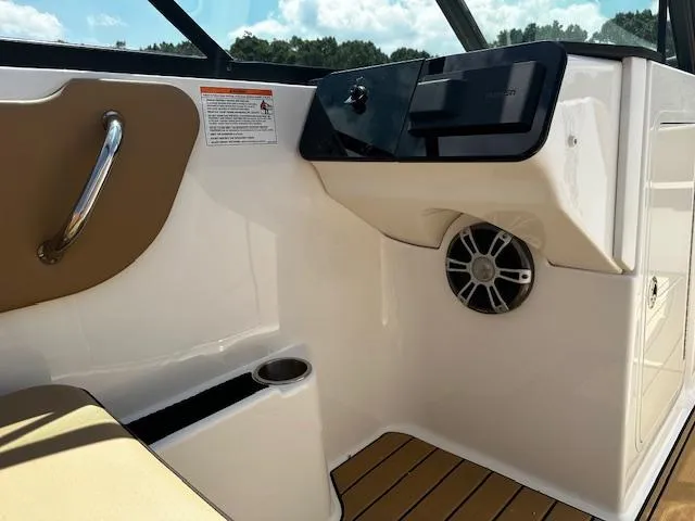 Slide: The Image of 2025 Sea Ray SDX 270 interior with speaker and cup holder. - 7