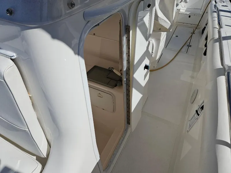 Slide: The Image of 2004 Marlago FS35 boat interior with open cabin door. - 15