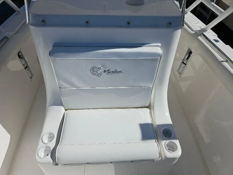 Slide: The Image of White seating on 2004 Marlago FS35 boat with cup holders. - 18