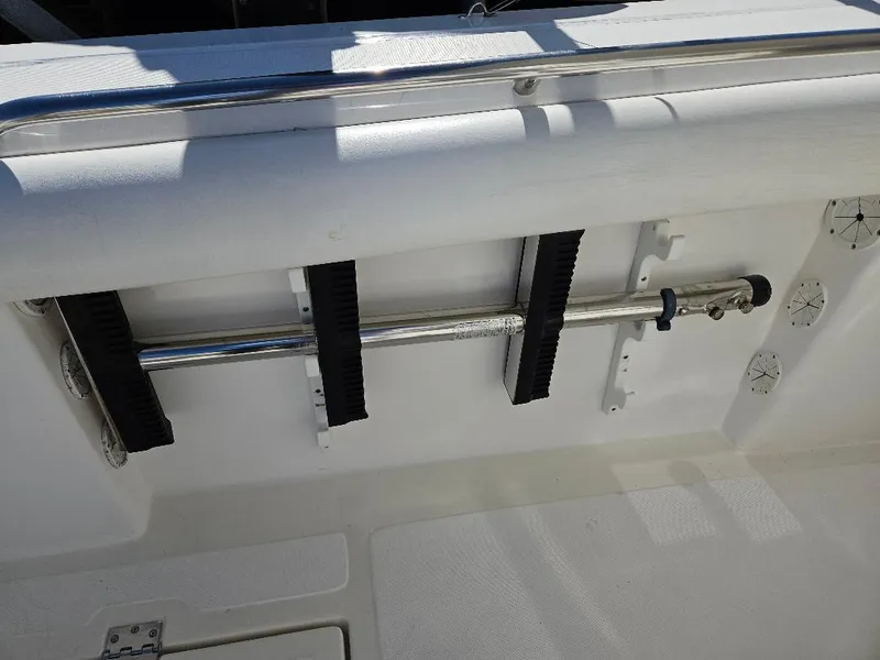 Slide: The Image of 2004 Marlago FS35 boat interior with stainless steel rail and rod holders. - 27
