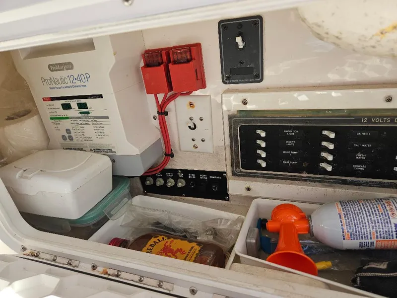 Slide: The Image of Electrical panel and storage compartment in 2004 Marlago FS35 boat. - 34