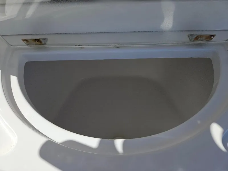 Slide: The Image of Open storage compartment on a 2004 Marlago FS35 boat. - 38
