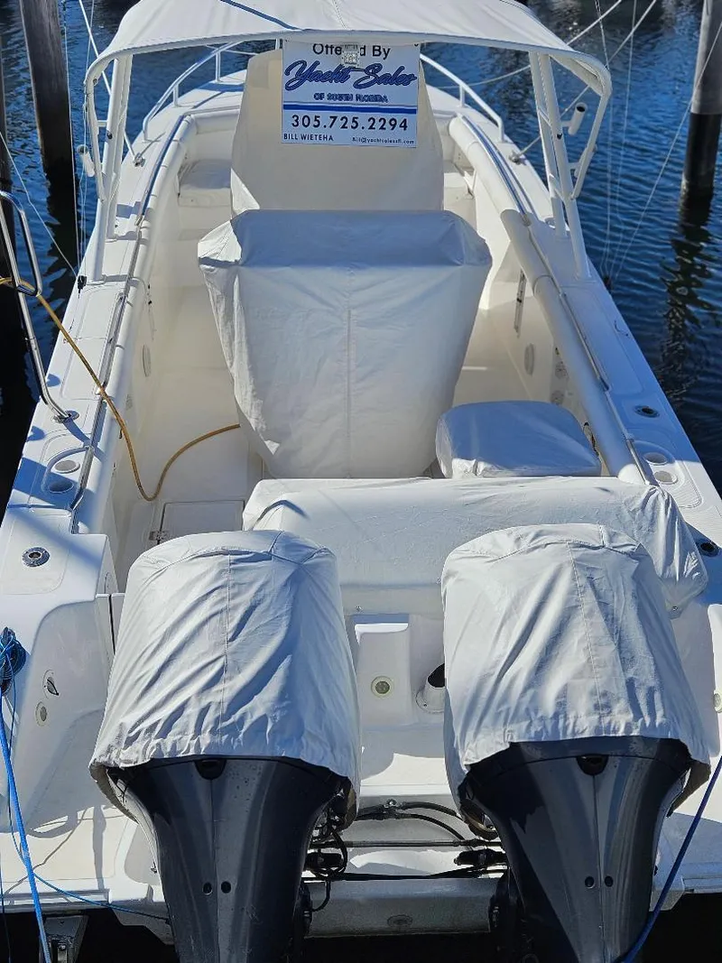 Slide: The Image of 2004 Marlago FS35 boat with covered engines docked in marina. - 5