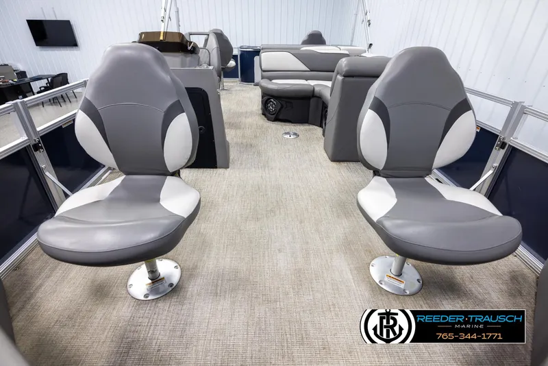 Slide: The Image of 2024 Avalon VEN QF boat interior with gray seating and carpeted flooring. - 13
